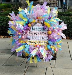 a welcome sign is decorated with colorful ribbons