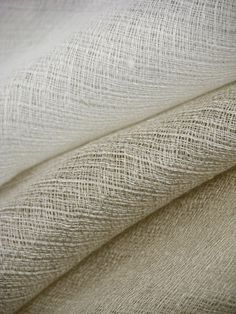 an up close shot of the fabric material for a bed sheet or pillow coverlet