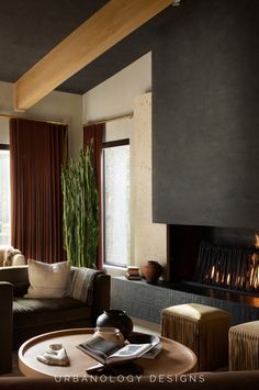 Discover the earthy elegance of this quiet luxury living room designed by Urbanology Designs. Featuring a modern fireplace, natural textures, rich hues, and organic decor, this space creates a serene yet sophisticated ambiance. Perfectly blending contemporary design with earthen inspiration, it’s part of Urbanology’s Dallas luxury project. Urbanology Designs offers nationwide interior design services to bring your dream home to life.