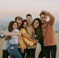 a group of young people standing next to each other