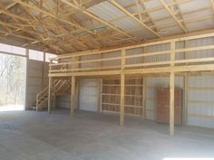 an empty garage is shown with no one in the room or on the stairs to the second floor