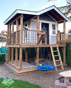 a small house with a swing set in the yard