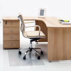 an office chair sitting next to a wooden desk