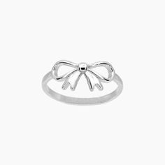 Add a touch of elegance to your outfit with our Bow Ring in a beautiful Rhodium finish. The intricate bow design adds a dainty yet bold statement to any look. Perfect for those who appreciate delicate yet stunning jewelry. *Also available in GOLD PRODUCT DETAILS Width: 3/8" Metal: Rhodium Pated Brass Silver Bow Ring, Feminine Silver Jewelry With Bow, Delicate Silver Jewelry With Bow Detail, Delicate Silver Jewelry With Bow, Chic Silver Jewelry With Ribbon, Minimalist Party Jewelry With Bow, Feminine Bow Jewelry For Wedding, Chic Silver Jewelry With Bow Tie Detail, Elegant Bow Ring For Gifts