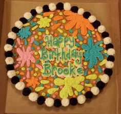 a decorated birthday cake in a box with the words happy birthday brooke