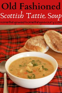 an old fashioned scottish tattoo soup is served in a white bowl with bread on the side