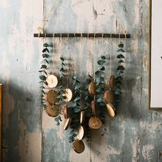 there is a wooden wall hanging with leaves and mushrooms on it, along with other things