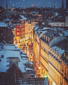 the city is covered in snow at night