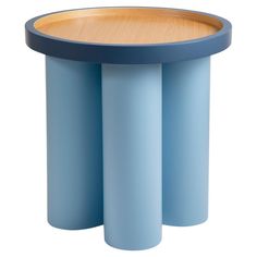 a blue table with three round wooden trays on the top and bottom, in front of a white background