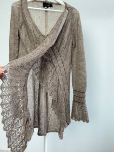 Vintage beautiful brown comfy cardigan, sweater, that looks like knitted lace! Closure is 2 shoulder buttons. Length 91 cm, 35 3/4 inchs Would fit sizes xs s m, depending on desired fit. Great as oversized. 63% super kid mohair  25% polyamide fibre  12% lana wool If you have any questions, please let me know, I will be happy to answer! Best wishes, Juta Cozy Fitted Fine Knit Cardigan, Brown Knit Long Sleeve Sweater Coat, Bohemian Long Sleeve Cable Knit Sweater, Fitted Long Sleeve Cardigan With Pointelle Knit, Fitted Long Sleeve Pointelle Knit Cardigan, Fitted Long Sleeve Sweater With Lace Trim, Fitted Bohemian V-neck Sweater, Winter Pointelle Knit Long-sleeve Outerwear, Winter Long Sleeve Pointelle Knit Outerwear