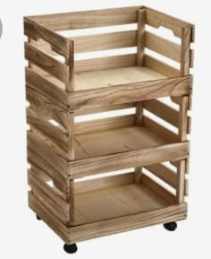 three wooden crates stacked on top of each other, one with wheels and the other without