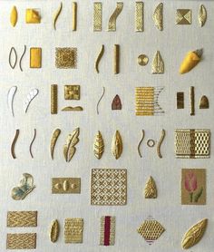 some very pretty gold colored items on a white surface