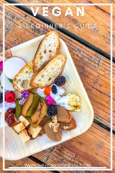 the vegan platter is full of fresh fruit, bread and other food items