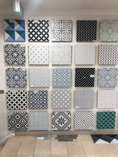 a wall with many different tiles on it