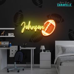 a neon sign that reads, johnon with a football on it in a bedroom