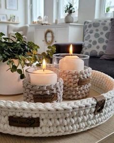 crocheted tray with three candles on it