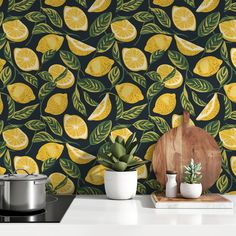 a kitchen wall with lemons and leaves on it