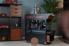 a wooden cabinet with wine bottles in it and a toy car on the shelf next to it