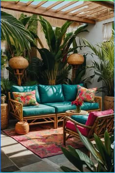 a living room filled with lots of plants and couches covered in blue leather cushions