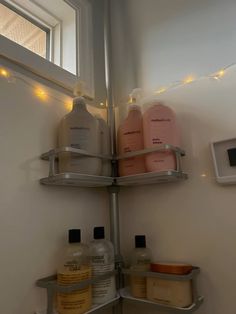 the shelves in the bathroom are organized with soaps and lotions