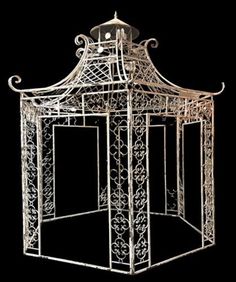 a white metal gazebo sitting on top of a black background with an intricate design