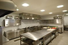 a kitchen with stainless steel appliances and counters