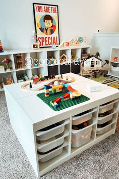 a child's playroom with toys and storage bins