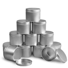 many tins are stacked on top of each other