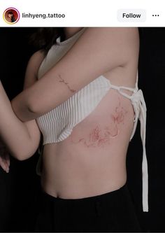 a woman with a tattoo on her stomach is shown in the image above it's photo