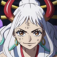 an anime character with white hair and horns on her head, staring at the camera