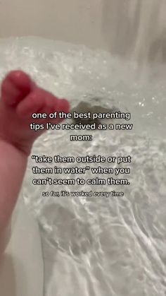 a baby's foot in a bathtub with the words, one of the best parenting tips i've received as an new mom