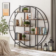 a living room with bookshelves and plants on the shelves in front of it