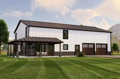 a large white barn style house with a covered porch and two car garages on the side