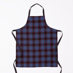 a green and red plaid apron with black straps on the front, featuring an image of a