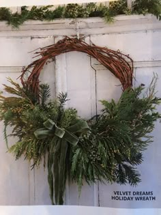 a wreath is hanging on the front door