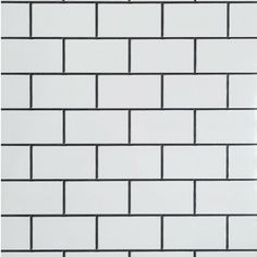 a white brick wall with black lines on it