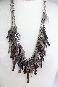 "Vintage Antique Distressed Keys Skeleton Keys Lock Handcrafted Repurposed Statement Charm Necklace OOAK Steampunk Novelty Quirky Jewelry. Love the vintage look in your home??? Incorporate it into your dressing as well This hand crafted double strand statement necklace contains an assortment of 45 vintage, distressed keys of various complimentary sizes that I have collected over the years. Also attached is a little lock and key that you can take off and use if you choose! Measures 16 1/2\" long. Old Keys Crafts Diy, Repurposed Accessories, Junk Necklace, Clutter Necklace, Skeleton Key Lock, Goodwill Bins, Skeleton Key Jewelry, Key Diy, Key Crafts