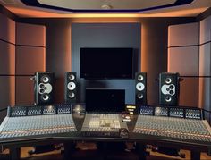 a recording studio with sound equipment and monitors