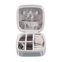 an open silver case with jewelry inside on a white background in the shape of a suitcase