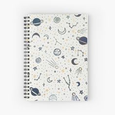 a spiral notebook with planets and stars on it