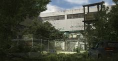 an old building with graffiti on it and trees in the foreground, next to a truck