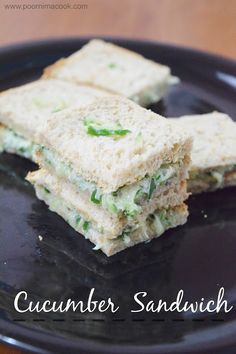 two sandwiches on a black plate with the words cucumber sandwich written below it