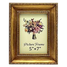 an ornate gold frame with flowers on it