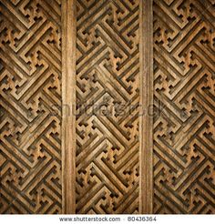 an old wooden wall with intricate patterns