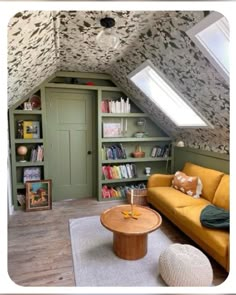 a living room with a yellow couch and bookshelf