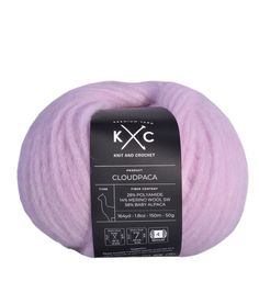 a skein of pink yarn with the words kcc in black and white on it