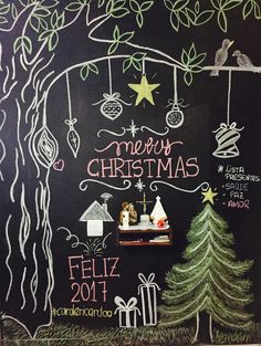 a chalk board with christmas decorations on it