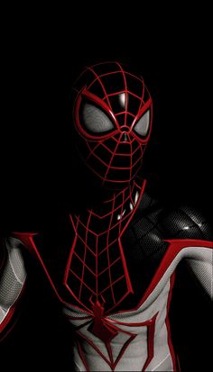 a spider man is standing in the dark