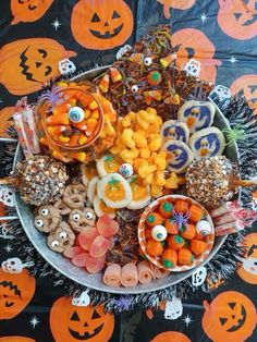 a platter filled with halloween treats on top of a table