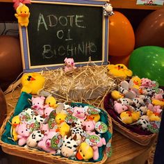 two baskets filled with small rubber ducks next to a chalkboard that says,'addie of bhiming '